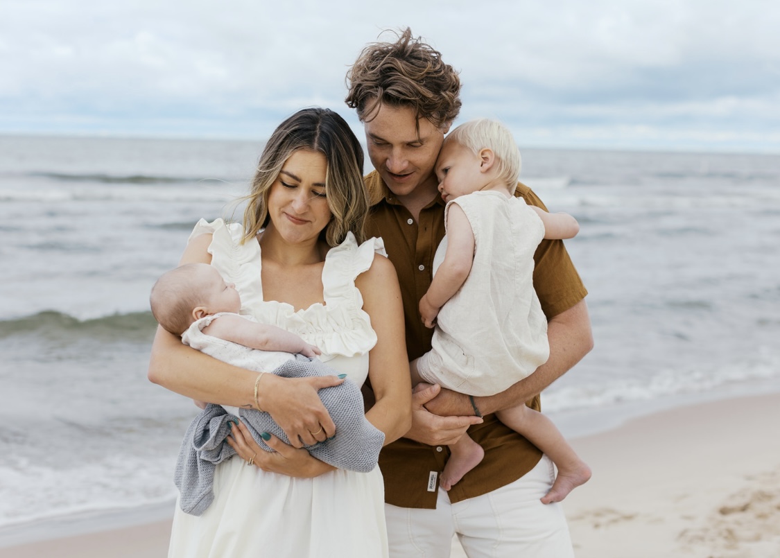 Brad Jackson with his family on the beach